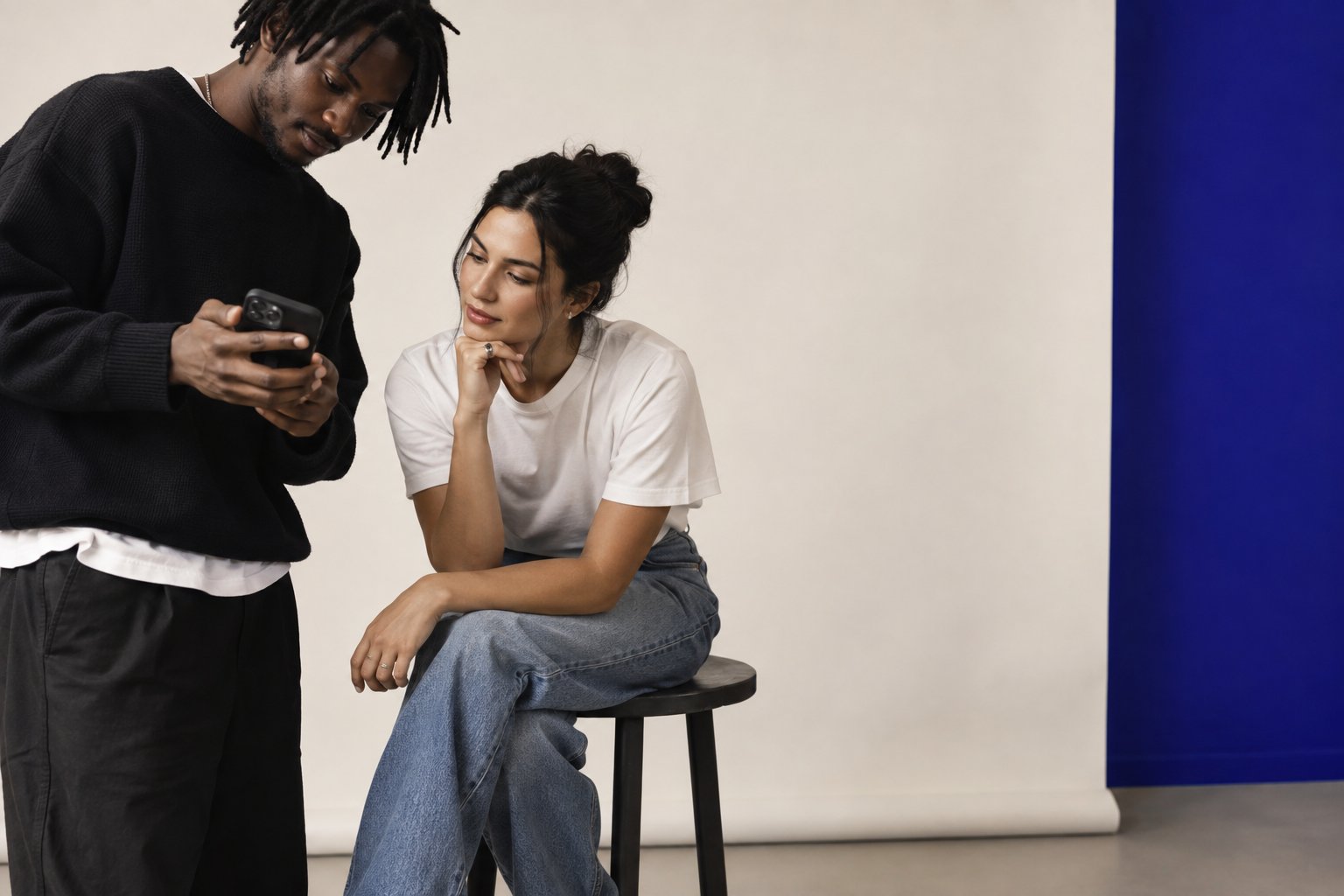 Two creators reviewing content together in a studio